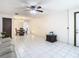 Open-concept living and dining area with tiled floors at 5316 Buttonwood Dr, New Port Richey, FL 34652