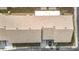 Aerial view of a residential roof, featuring brown shingles and vents at 5316 Buttonwood Dr, New Port Richey, FL 34652