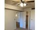 Bedroom with ceiling fan and access to a spacious closet at 5920 80Th N St # 110, St Petersburg, FL 33709