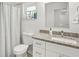 Clean bathroom with granite countertop, shower/tub combo, and white vanity at 6459 30Th N Ave, St Petersburg, FL 33710