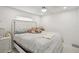 A comfortable bedroom with a plush bed, white headboard, and nightstands at 6459 30Th N Ave, St Petersburg, FL 33710