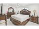 Large main bedroom with ornate wood furniture and ceiling fan at 6459 30Th N Ave, St Petersburg, FL 33710