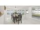 Bright dining area with large windows, a dark wood table, and black chairs at 6459 30Th N Ave, St Petersburg, FL 33710