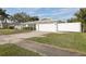 Single-story home with a white picket fence and attached garage at 6459 30Th N Ave, St Petersburg, FL 33710