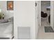 Hallway leading to a living area with a recliner and TV at 6459 30Th N Ave, St Petersburg, FL 33710