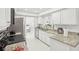 Updated kitchen featuring white cabinetry, granite counters, and stainless steel appliances at 6459 30Th N Ave, St Petersburg, FL 33710