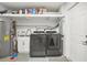 Laundry room with washer, dryer, utility sink, and storage at 6459 30Th N Ave, St Petersburg, FL 33710