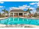 Covered cabana overlooking community pool at 704 160Th E Ln, Bradenton, FL 34212