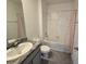 Clean bathroom with shower/tub combo, granite vanity, and tile floor at 8379 Ender Hills Dr, Wesley Chapel, FL 33545