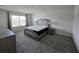Comfortable bedroom with gray carpeting, window, and a matching bedroom set at 8379 Ender Hills Dr, Wesley Chapel, FL 33545