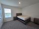 Bedroom with neutral walls, carpet, bed and dresser at 8379 Ender Hills Dr, Wesley Chapel, FL 33545