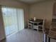 Dining area with sliding glass doors to the backyard and a view at 8379 Ender Hills Dr, Wesley Chapel, FL 33545