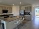 Modern kitchen with stainless steel appliances and granite countertops at 8379 Ender Hills Dr, Wesley Chapel, FL 33545