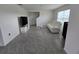 Living room with white sofa, large windows, and tile flooring at 8379 Ender Hills Dr, Wesley Chapel, FL 33545