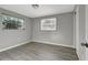 Empty bedroom with gray walls, wood-look flooring, and windows with blinds at 919 32Nd E Ave, Bradenton, FL 34208