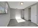 Bright, empty bedroom with gray walls and wood-look flooring at 919 32Nd E Ave, Bradenton, FL 34208