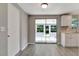 Open concept dining area with sliding glass doors that lead to a patio at 919 32Nd E Ave, Bradenton, FL 34208