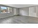 Bright living room with gray walls, wood-look floors, and built-in shelving at 919 32Nd E Ave, Bradenton, FL 34208