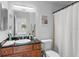 Clean bathroom with granite vanity and shell sink at 10265 Gandy N Blvd # 808, St Petersburg, FL 33702