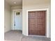 Charming front entrance with brick pavers, decorative door and two car garage at 10864 Banyan Breeze Blvd, Land O Lakes, FL 34638