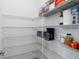 Spacious pantry with wire shelving, loaded with supplies at 10864 Banyan Breeze Blvd, Land O Lakes, FL 34638