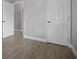 Empty bedroom with gray walls, white trim, and wood-look tile flooring at 13122 4Th E St, Madeira Beach, FL 33708