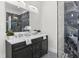 Modern bathroom featuring a double vanity and walk-in shower at 1716 22Nd N Ave, St Petersburg, FL 33713