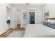 Main bedroom with queen bed, walk-in closet, and bathroom access at 1716 22Nd N Ave, St Petersburg, FL 33713