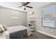 Bright bedroom with a comfy bed, window, and modern shelving at 1716 22Nd N Ave, St Petersburg, FL 33713
