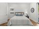 Bright bedroom with a queen-size bed and wood flooring at 1716 22Nd N Ave, St Petersburg, FL 33713