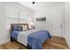 Bedroom with a double bed, hardwood floors, and large window at 1716 22Nd N Ave, St Petersburg, FL 33713