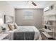 Bedroom with a queen bed, shelving, and window at 1716 22Nd N Ave, St Petersburg, FL 33713