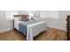 Well-lit bedroom featuring a bed and hardwood floors at 1716 22Nd N Ave, St Petersburg, FL 33713