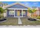 Charming craftsman home with a welcoming front porch and nicely landscaped lawn at 1716 22Nd N Ave, St Petersburg, FL 33713