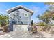 Two-story house with a white garage door and wooden fence at 1716 22Nd N Ave, St Petersburg, FL 33713