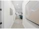 Long hallway with minimalist decor and view to living area at 1716 22Nd N Ave, St Petersburg, FL 33713