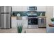 Modern kitchen with stainless steel appliances and subway tile backsplash at 1716 22Nd N Ave, St Petersburg, FL 33713