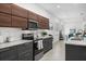 Open concept kitchen with stainless steel appliances and wood cabinets at 1716 22Nd N Ave, St Petersburg, FL 33713
