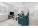 Living room with teal sofas, coffee table, and entryway view at 1716 22Nd N Ave, St Petersburg, FL 33713