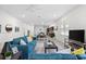 Open living space with teal sofas, coffee table, and kitchen view at 1716 22Nd N Ave, St Petersburg, FL 33713