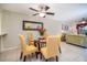 Bright dining area with glass table and four chairs at 1743 Golfview Dr # 1743, Tarpon Springs, FL 34689