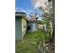 Backyard with patchy grass and a small garden at 1787 Shore Acres Ne Blvd, St Petersburg, FL 33703