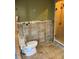 Toilet and shower in a bathroom under renovation at 1787 Shore Acres Ne Blvd, St Petersburg, FL 33703