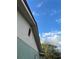 Green house exterior with a partially visible yard at 1787 Shore Acres Ne Blvd, St Petersburg, FL 33703