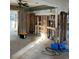 Gutted kitchen with exposed framing and plumbing at 1787 Shore Acres Ne Blvd, St Petersburg, FL 33703