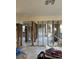 Extensive damage to the living room with exposed framing at 1787 Shore Acres Ne Blvd, St Petersburg, FL 33703