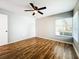 Bright bedroom with hardwood floors and ceiling fan at 1836 Cypress Trace Dr # 0, Safety Harbor, FL 34695