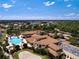 Aerial view of community clubhouse and pool at 1847 Pacific Dunes Dr, Sun City Center, FL 33573