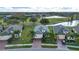 Three similar houses in a community near a golf course and pond at 1847 Pacific Dunes Dr, Sun City Center, FL 33573