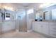 Spacious bathroom with double vanity, large shower, and granite counters at 1847 Pacific Dunes Dr, Sun City Center, FL 33573